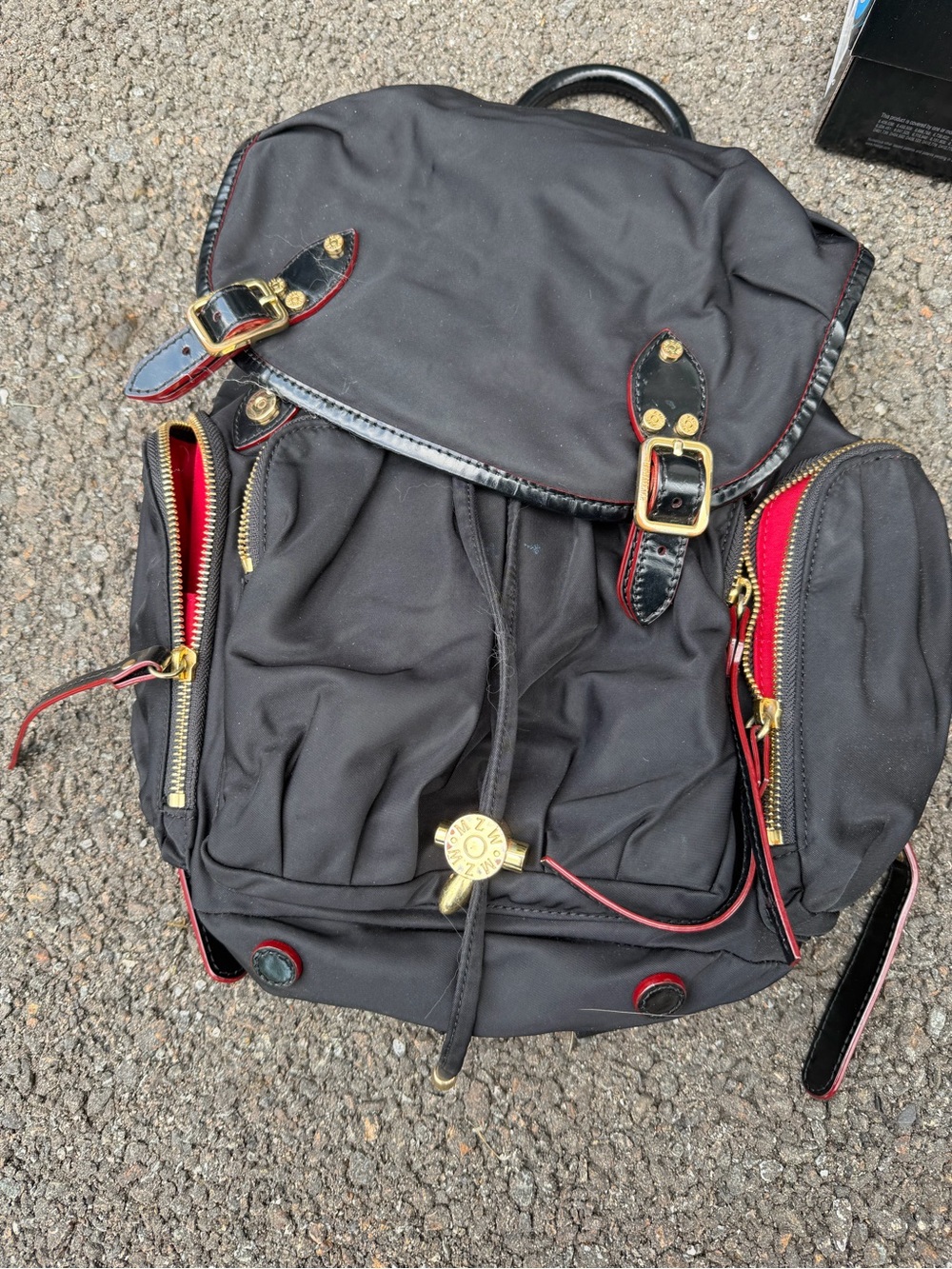 Black Nylon Backpack with Red Trim and Gold Hardware